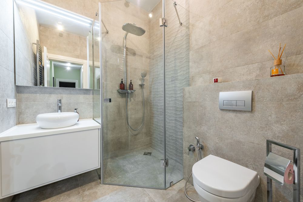 Bright bathroom remodel with a glass walk-in shower and double vanity